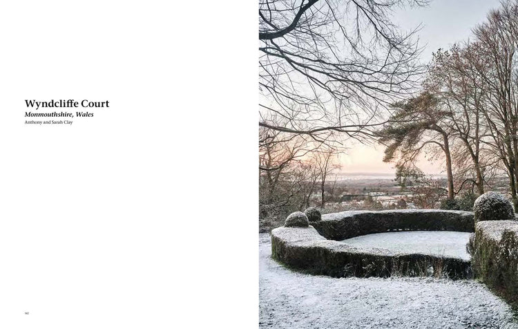 A split-page layout with a white left panel containing the text 'Wyndcliffe Court, Monmouthshire, Wales' and a right panel showing a snowy winter landscape with bare trees and a stone structure overlooking a distant town under a pale sky. From Winter Gardens by Montgomery Press. 