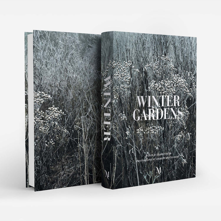 A hardcover book titled 'Winter Gardens' shown standing upright with its front cover and spine visible. The cover features a monochrome winter garden photograph in shades of gray, black, and white, with the title in large white serif text.